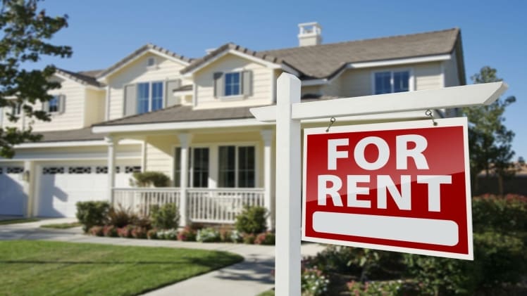 How to Get a Loan for a Rental Property for rent sign in front of house
